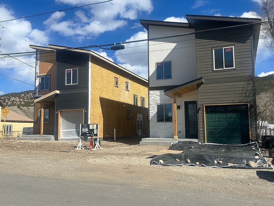 Front of duplex. This unit is behind the dupplex on the right. The duplex on the left should be finished in June. All landscaping and fencing to be completed by May.