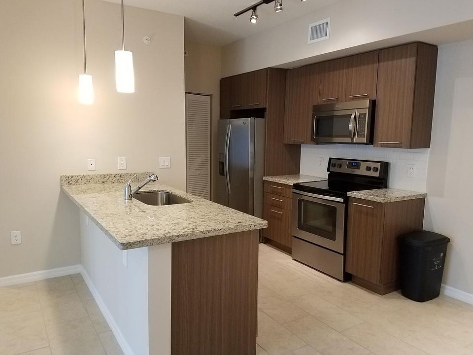 Kitchen Stainless steel appliances and granite counters tops