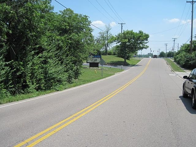 View looking south down Gebhart Church Road with Church entrance visible and traffic signal at State