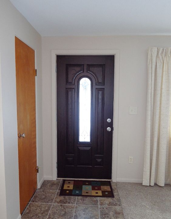 New ceramic tile entry. There is a coat closet to the left in this picture.