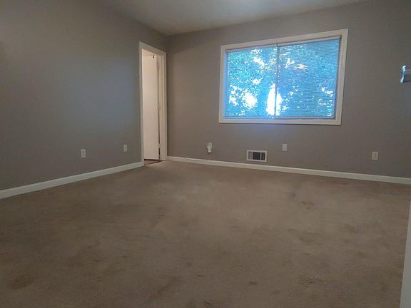 Master bedroom with door leading to private bath.