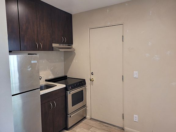 Upgraded kitchen and door to outside private yard