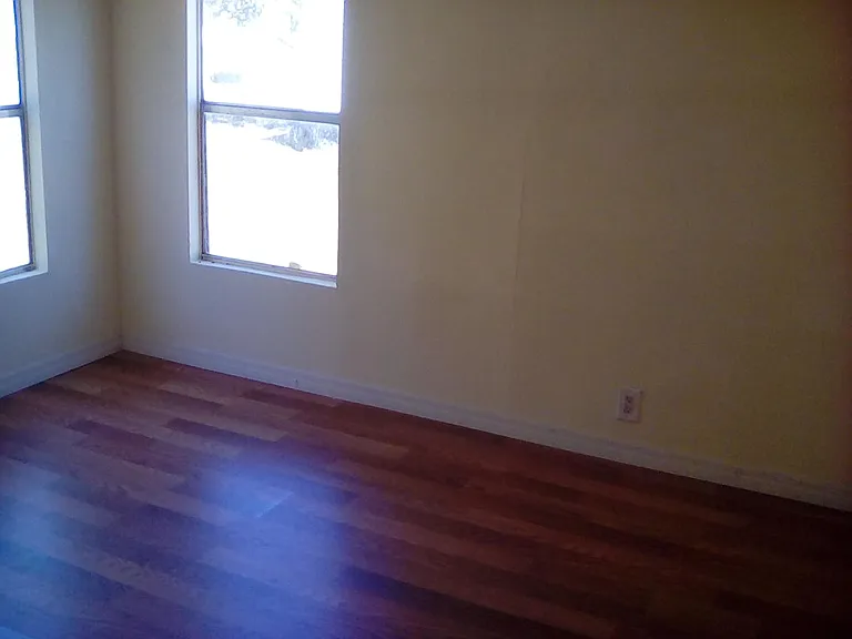 2nd Bedroom with new wood flooring - double corner windows