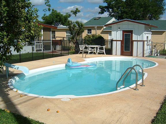 Lovely large backyard with great pool and large deck area. 