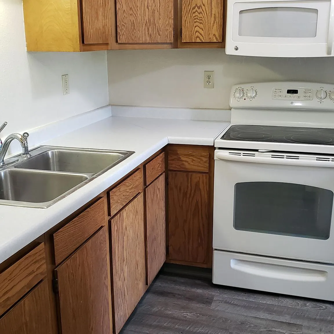Kitchen includes smooth-top range oven and microwave