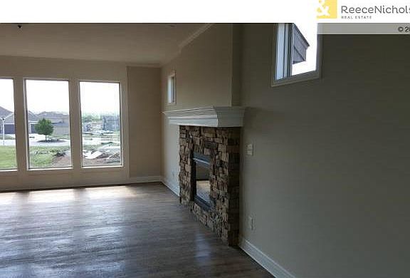 Great room with wall of windows and fireplace