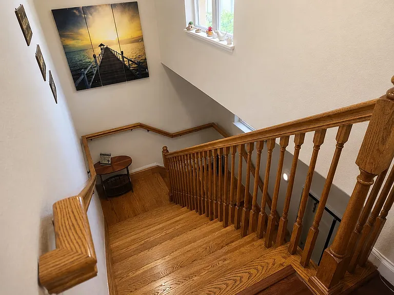 Stairs up to 2nd floor unit. Enter unit at ground floor.