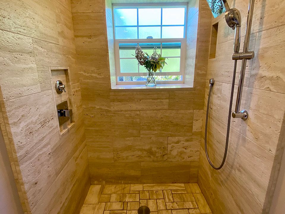 Master shower, travertine