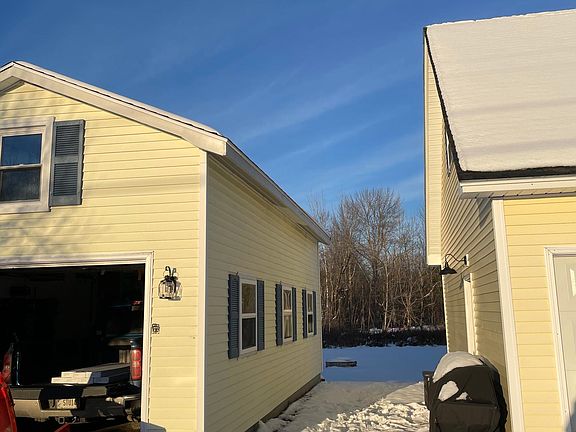 Walkway between attached garage and workshop/garage.