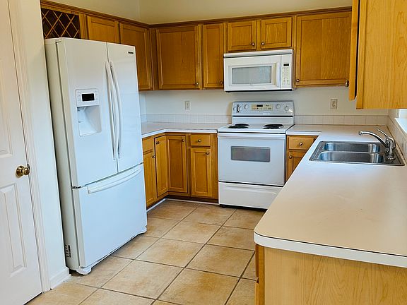 Roomy kitchen with built-in wine rack and dishwasher