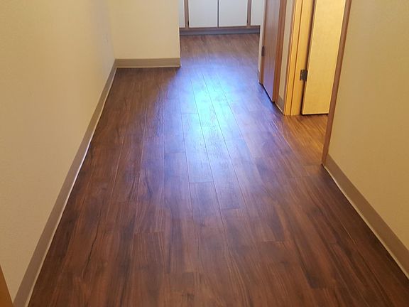 Entryway facing kitchen & pantry closet