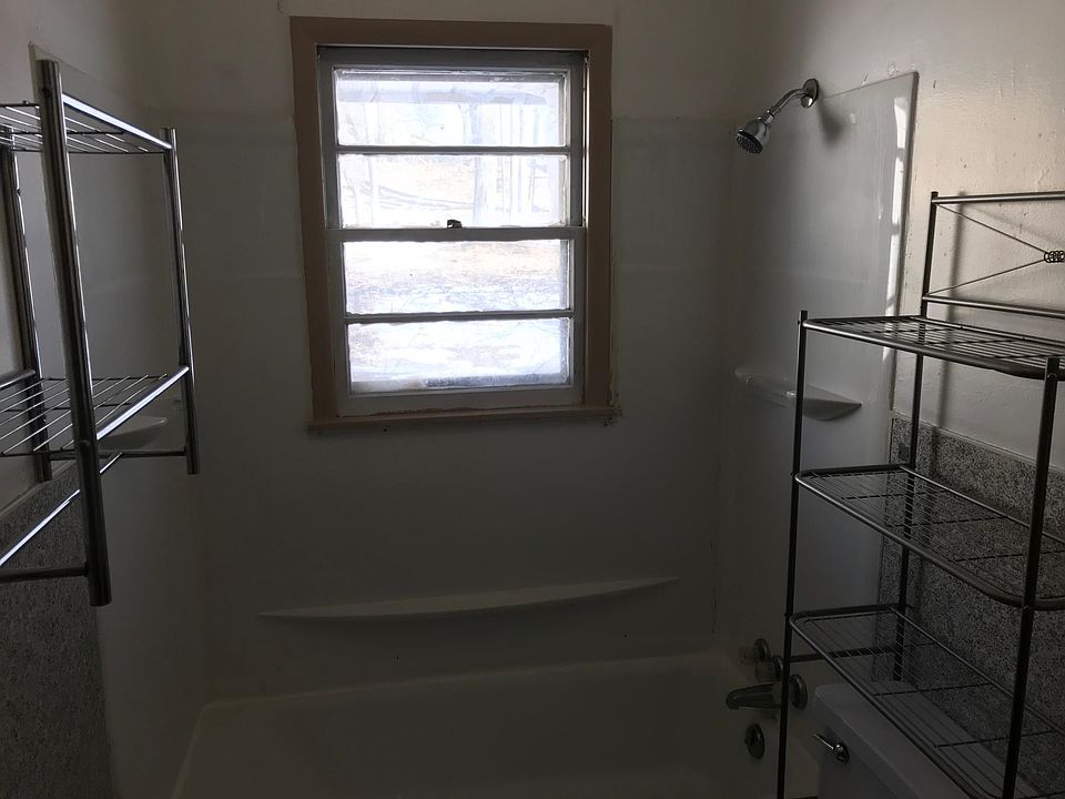 Bathroom with tub and shower. 