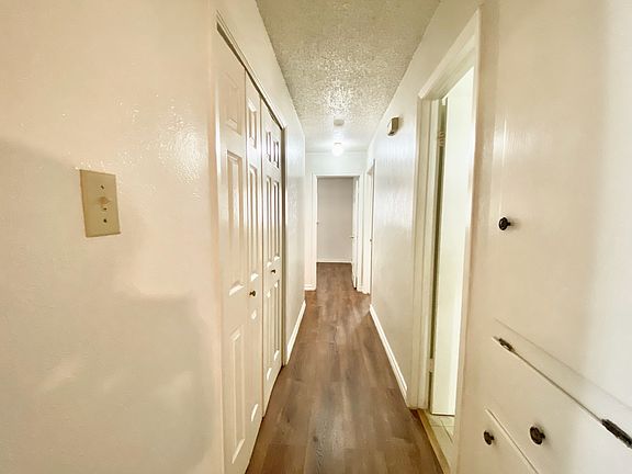 Hallway with 2 door closet on the left, full bathroom on the right, with rooms at the end: Master bedroom (right)