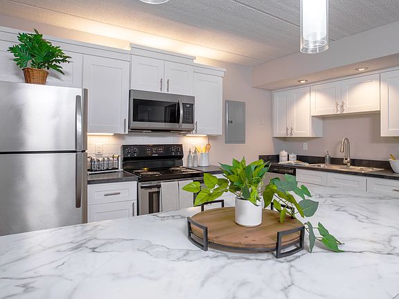 Discover sleek, stainless steel appliances and stylish cabinetry in our modern kitchens. Perfect for preparing meals with plenty of counter space.