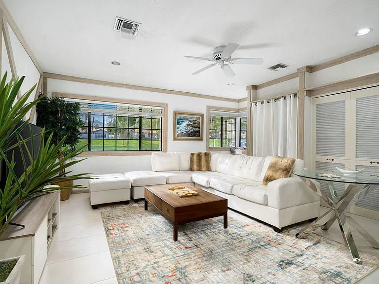 Bonus room with smart TV, bar and toilet area.