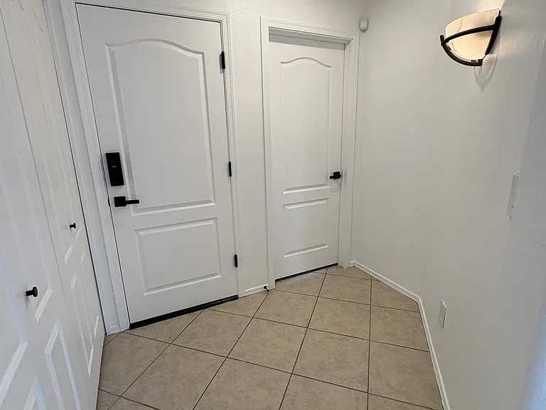 Hallway with laundry closet and more