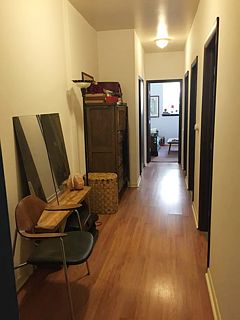 hallway view from kitchen area - facing room #2 (back room), which leads to yard. Room #1 and bathroom are to the right in hallway view