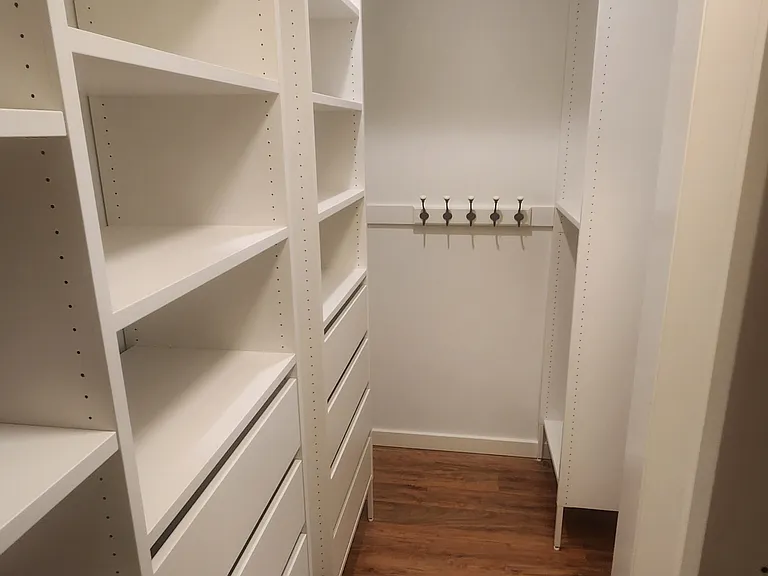 Master bedroom walk-in closet drawers and shelves