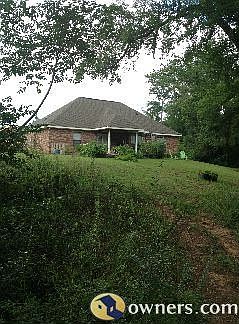 Back of house from trail between house and golf course