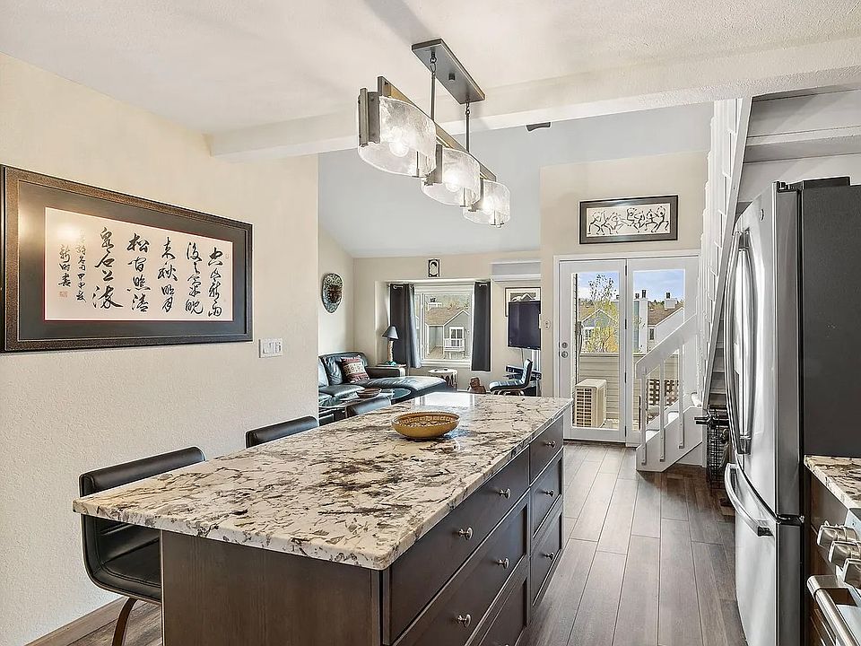 Kitchen looking to living room and northern mountains
