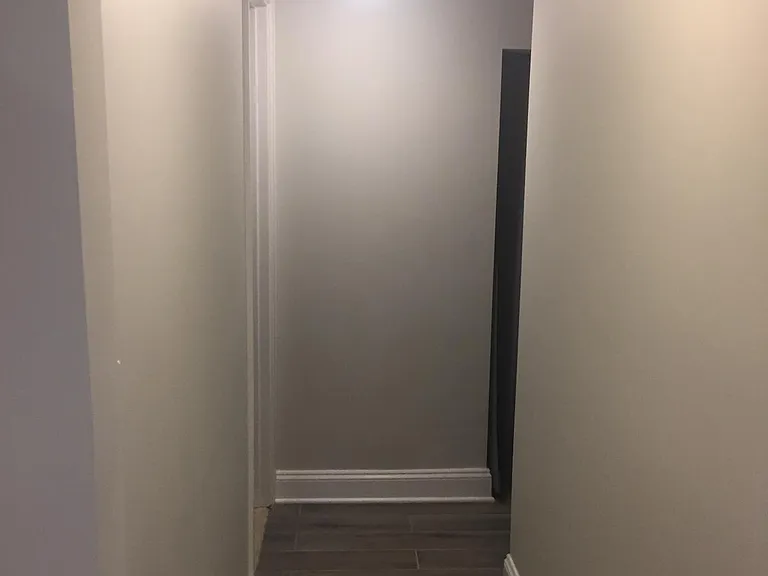 Hallway to bathroom and studio
