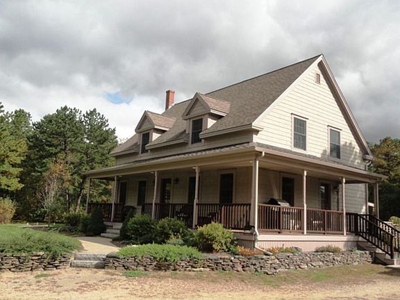 Stone wall, gardens and front walk way