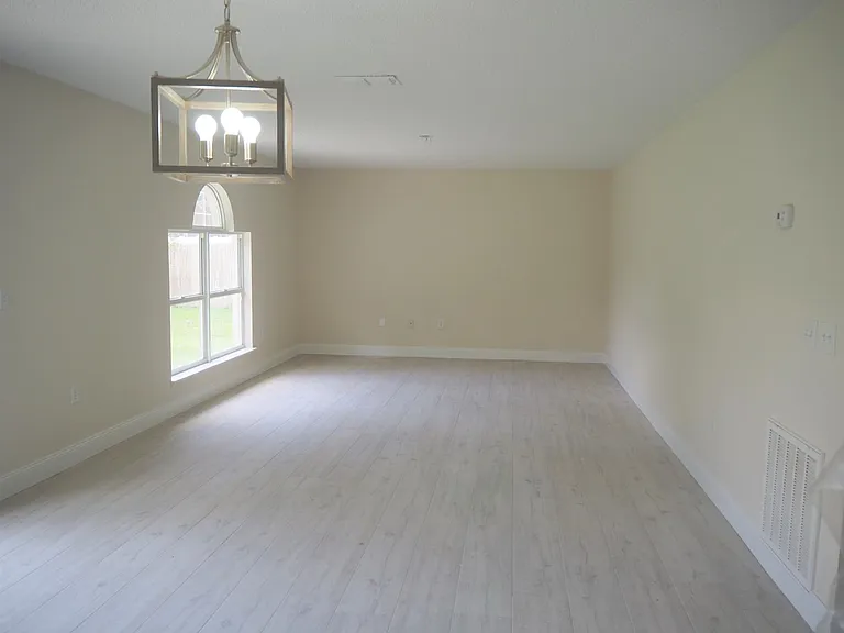 Looking from kitchen into breakfast area and family room