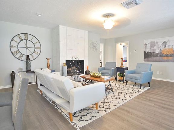 Extraordinary Family Room with tiled fireplace