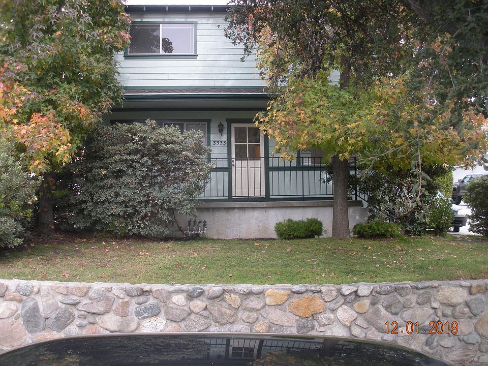 Front of unit with grass area and porch
