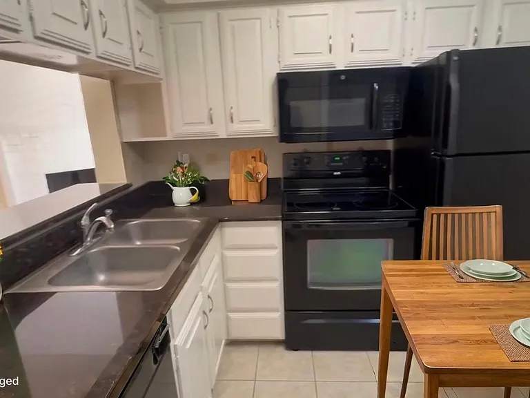 Staged kitchen. Use bar stools at the bar or kitchen table, your choice.
