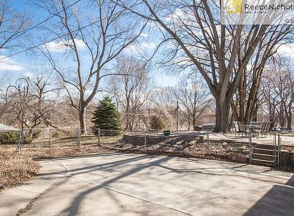 REAR ENTRY GARAGE PROVIDES LARGE DRIVEWAY AREA AND PATIO!