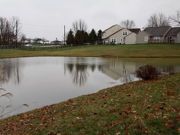 Wonderful large lot for neighborhood on pond. Open patio and screened porch, great for entertaining!