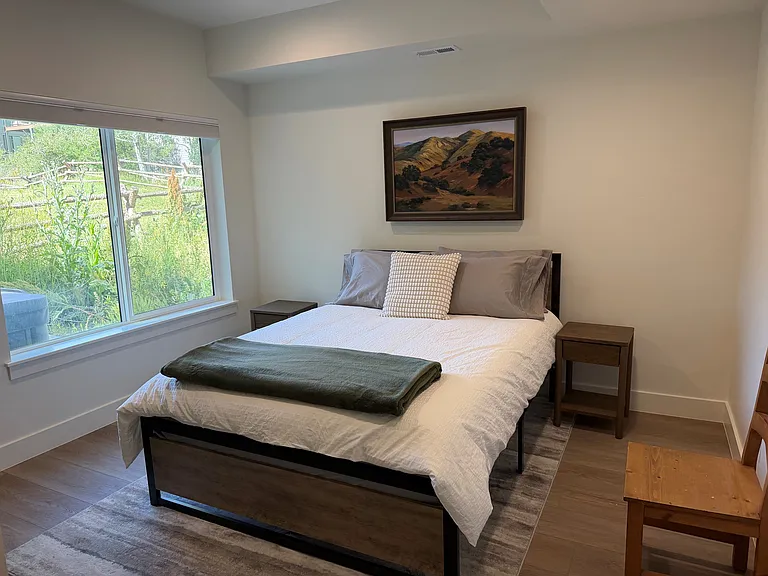 Lower level bedroom with queen bed
