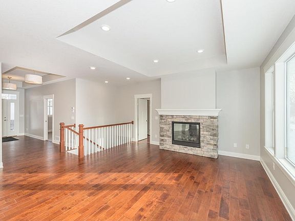 The gas fireplace is finished in stone and large custom mantle. This will keep guests warm on the coldest winter days.