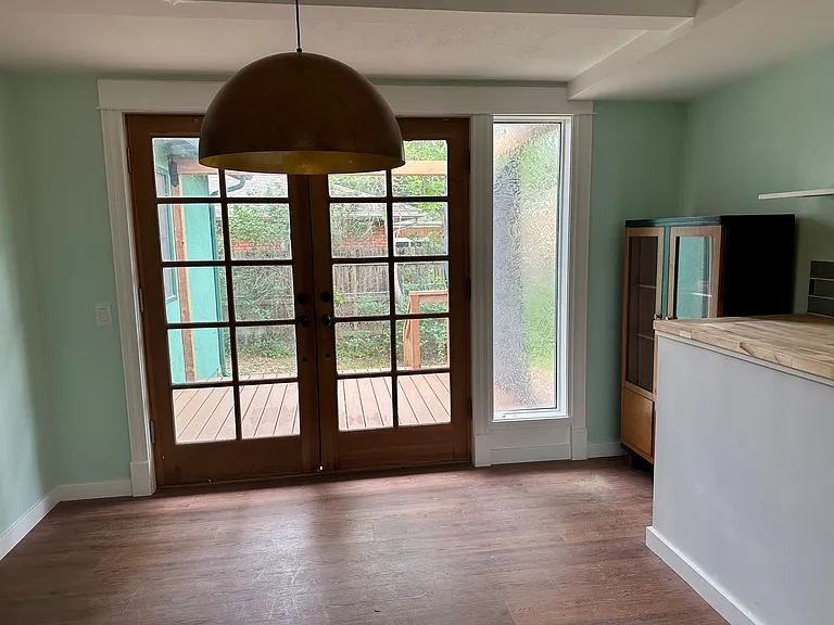 Dining area with French doors leading to private back deck