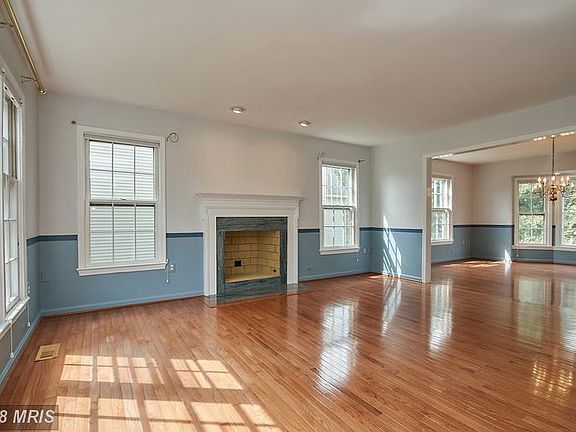 Living room with hardwood flooring and fireplace