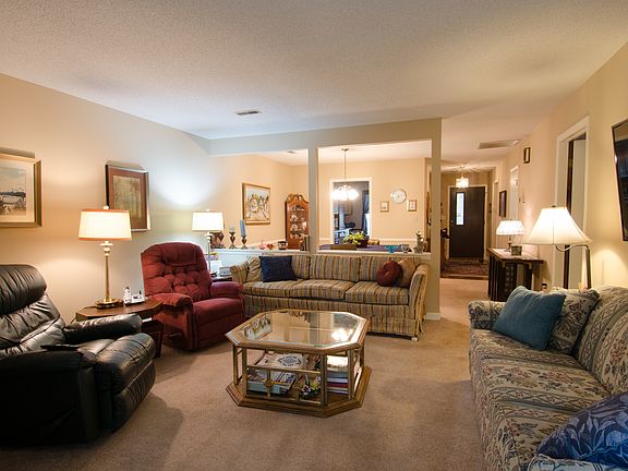 Living area with fireplace off dining