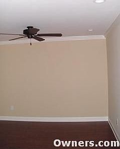 New bronze ceiling fan and wood floors