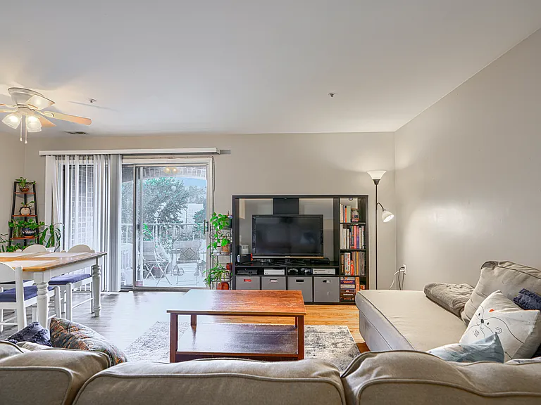 Living room w/ view of balcony