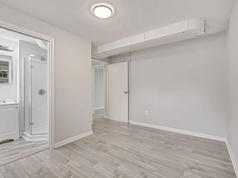 bottom floor - possible in-law suite - bedroom with ensuite bathroom