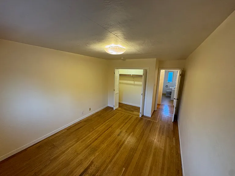 Bedroom looking toward closet and bathroom