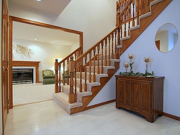 Main Entry with Open Staircase to the Upper Level