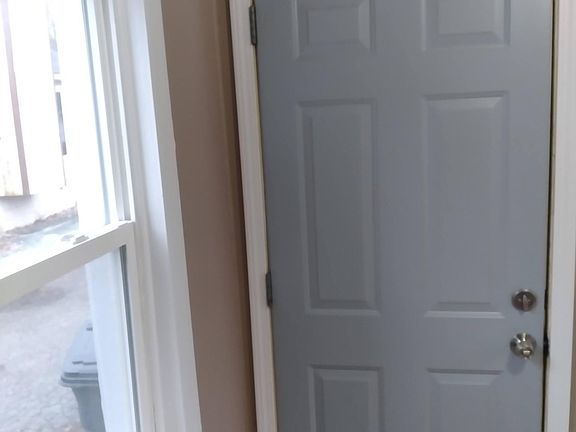 Back door entrance by parking