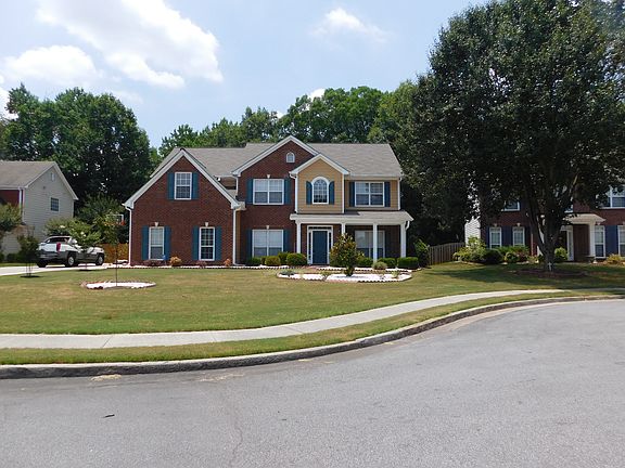 Long driveway and side entry garage