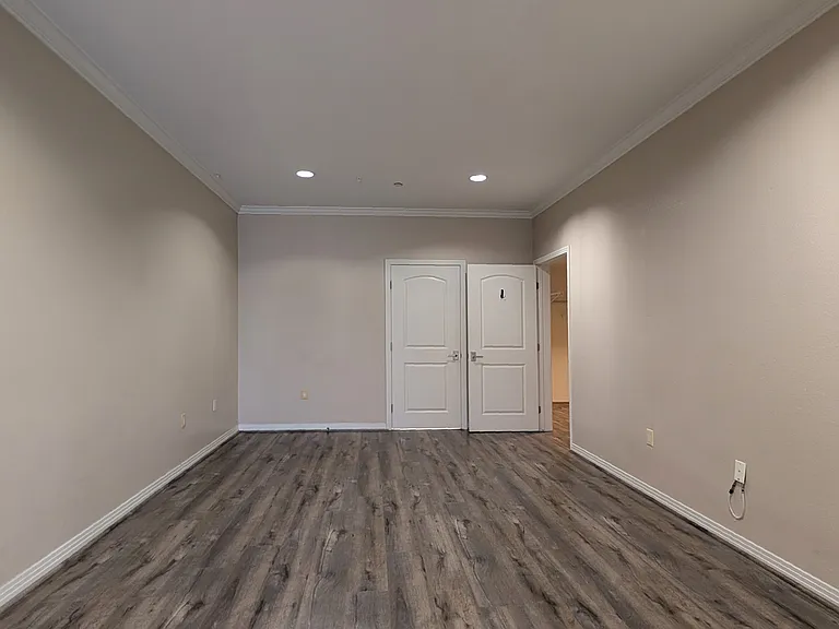 Another view of primary bedroom