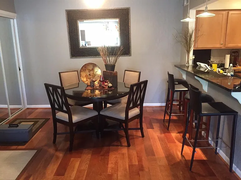 Entertain your guests--have a nice meal or stiff drink here...in your own Dining Room and Kitchen Bar with track lighting, high leather bar stools, and granite countertops!