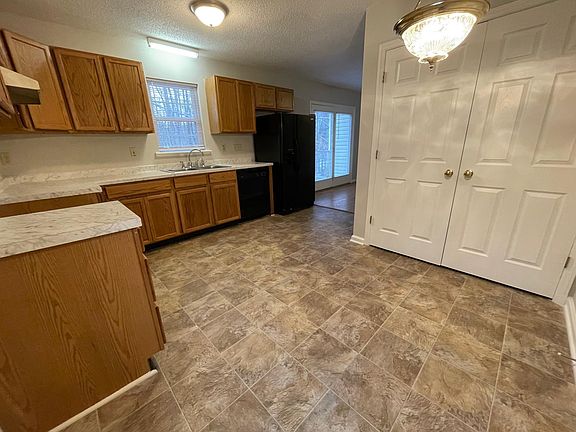 The laundry area is behind the double doors. There is also room for a table to eat in the kitchen