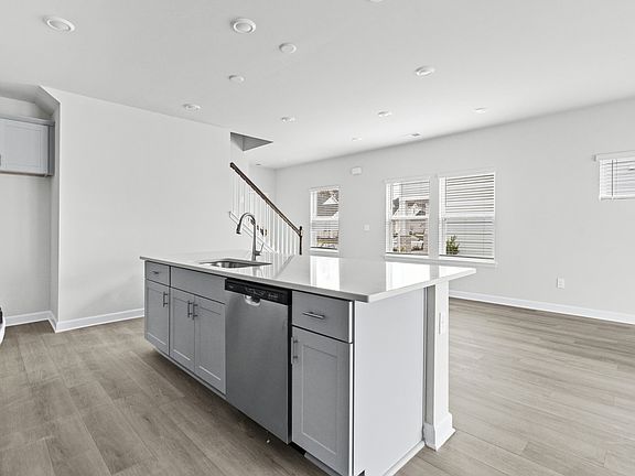 The well-appointed kitchen features a large island to make meal prep a breeze.