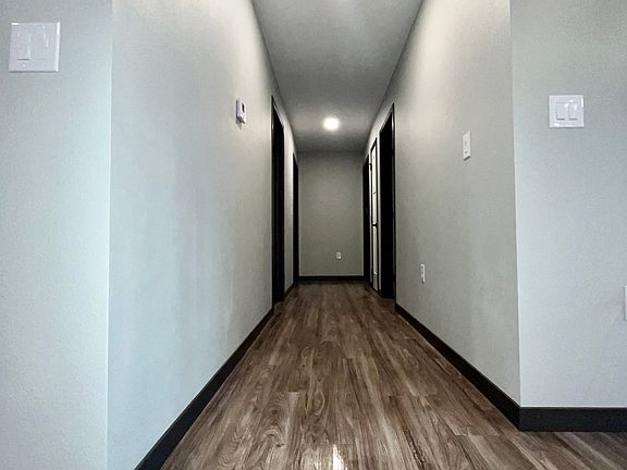 Hall to bedrooms & bathroom off of dining room
