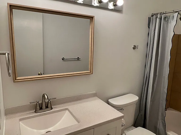 Upstairs full bath, new hardware, toilet and shower head.